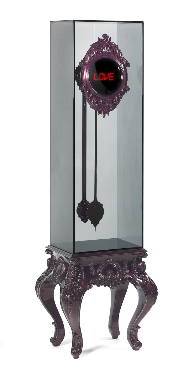 Carved digital clock made from mahogany. The pendulum is composed by stainless steel and it’s inside a tempered glass box. Hand carved mahogany base covered in silver leaf and finished with a high gloss translucent varnish.