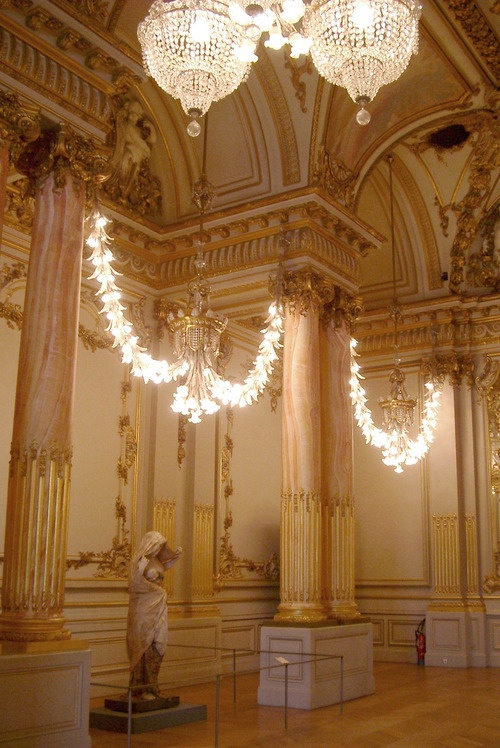 an ornate and decorative guilded interior in the french rococo style