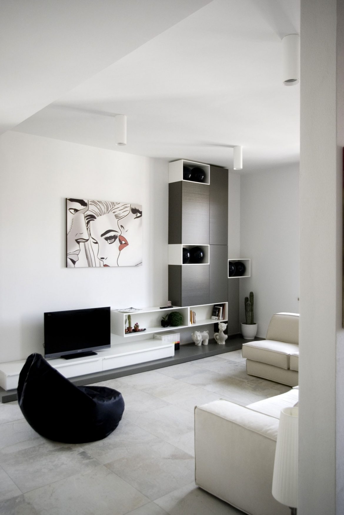 Black-And-White-Painting-Hanging-On-White-Wall-Above-Screen-Flat-TV1